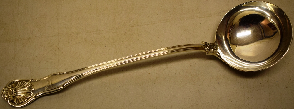 A Victorian kings husk pattern soup ladle, engraved a crest, with a circular bowl, Maker George