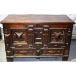 A late seventeenth century oak mule chest, the geometric panelled front, with arcaded centre
