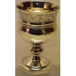 A Regency silver wine goblet, the campana shape bowl with an engraved border of foliage, the knopped