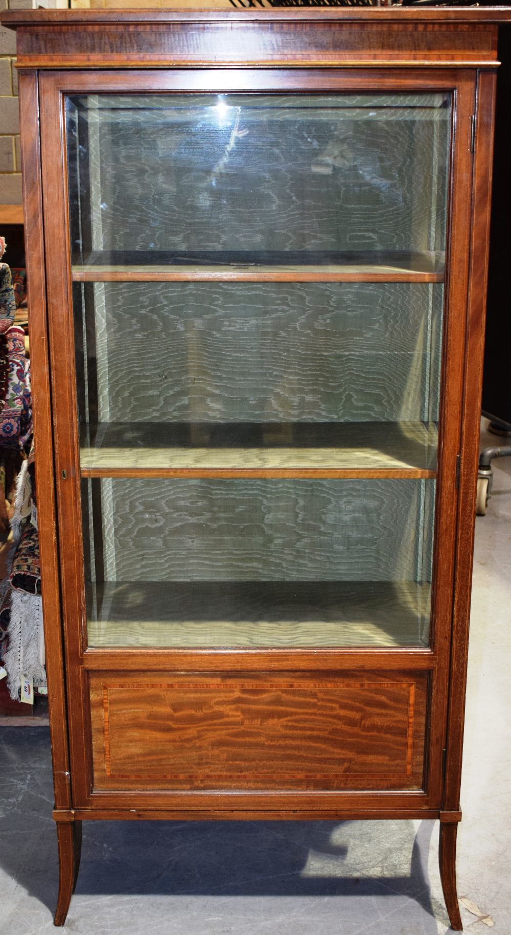 An Edwardian faded mahogany china cabinet, banded in satinwood and inlaid stringing, the top with