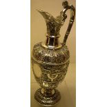 A Victorian Scottish silver 'Cellini' pattern mulled wine jug, the chased body with masks and a