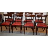 A set of eight William IV mahogany side chairs, with shell scroll carved back rails, the padded