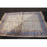 A modern blue and gold Persian style Rug with animals, trees and birds,