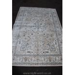 A modern pale grey and cream Persian style Rug,