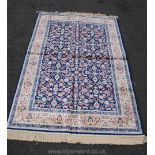 A modern blue and gold floral Persian style Rug,