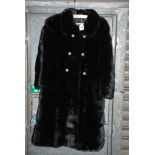 A 1960's knee length Mink Coat with paste buttons by "Magee",