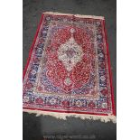 A modern red and blue Persian style Rug,