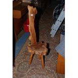 A modern Yew wood rustic Spinning style Chair with slab back and log seat, on three turned legs.