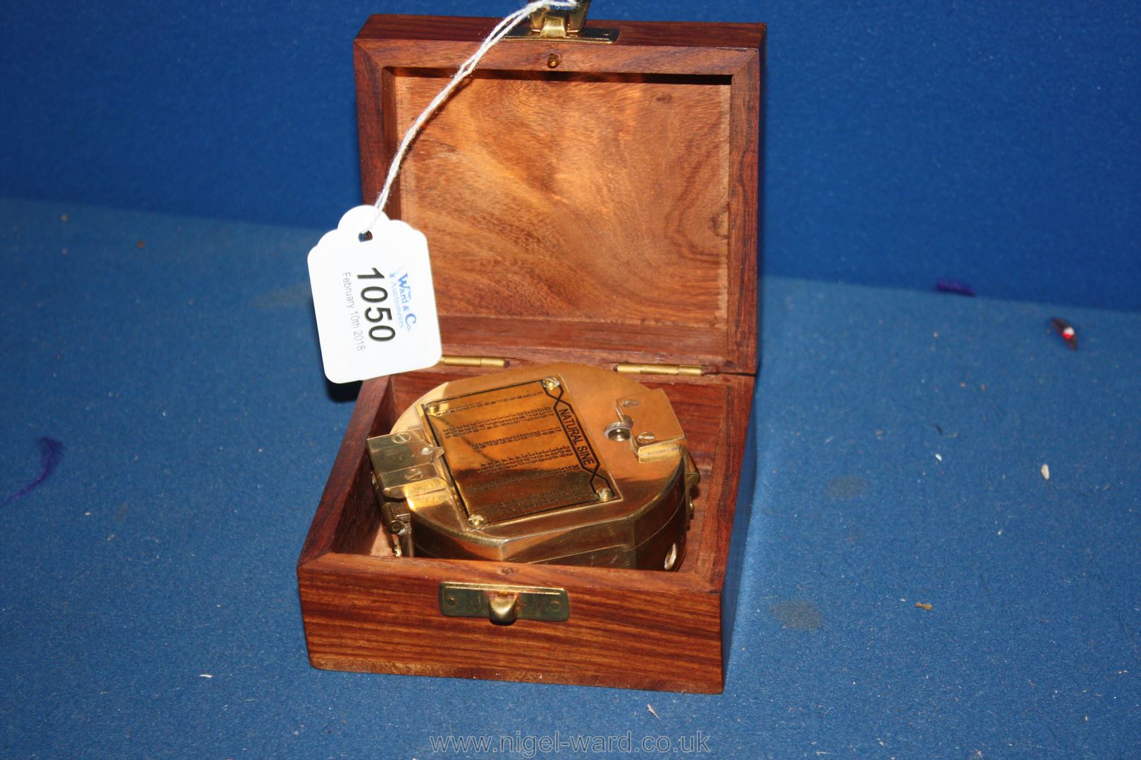 A brass Compass in wooden box