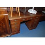 A pretty Victorian Mahogany Kneehole Desk with moulded edge, solid top,