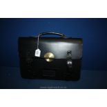 A leather Civil Service half strap Briefcase with heavy duty security deadlock,