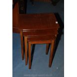 A Mahogany Nest of three bow fronted Occasional Tables, on square legs.