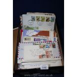 A large box of First Day and other Postal Covers, sheets of stamps,
