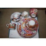 A box containing plates, bowls, cups and saucers,