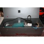 A metal cased Makita 9029, 2000 watt, 240 volt 9" Angle Grinder with various discs, etc.