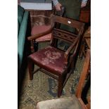 A Georgian style Mahogany Elbow Chair with moulded top rail, pierced and fret cut bar back,