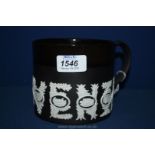 A black and white Wedgwood Sporting Mug designed by Richard Guyatt