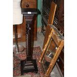 A carved wood Torchere/plant stand