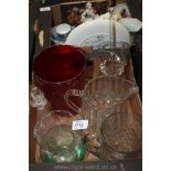 A quantity of glass including water jugs, red vase, large glass, etc.