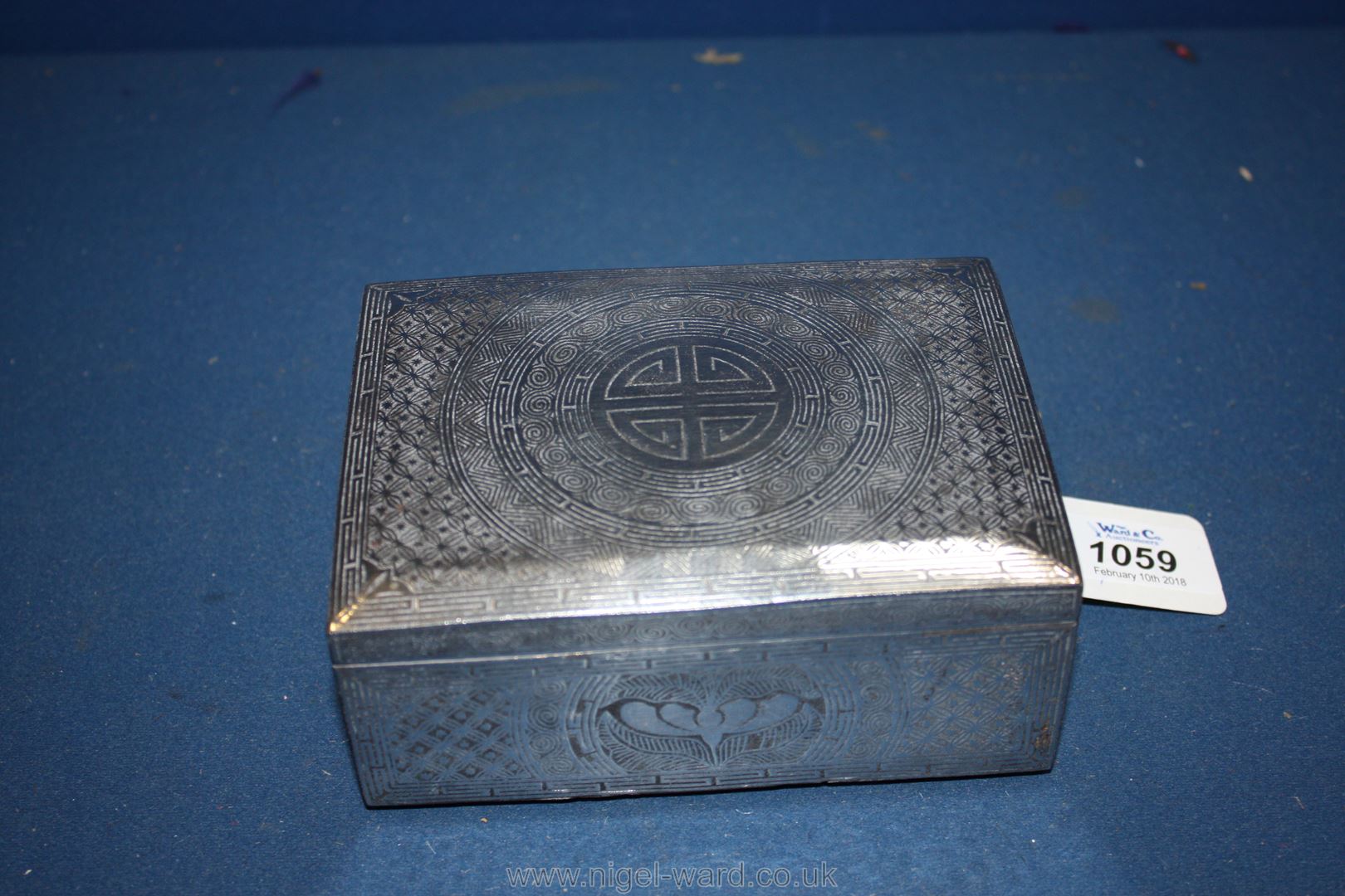 A heavy Chinese metal Cigar Box with silver wirework decoration,
