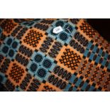 An orange and blue double Welsh Wool Blanket