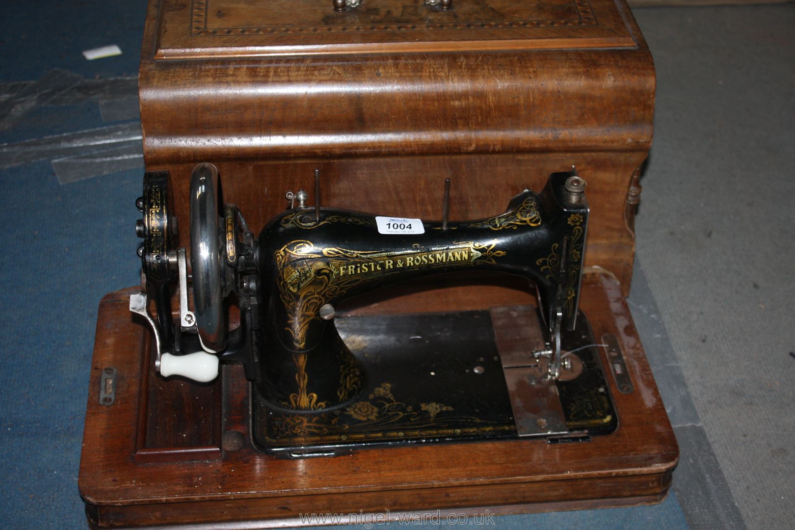 A Frister & Rossmann hand Sewing Machine with case and instructions