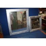 Two wall-hanging mirrors having silver coloured frames the glasses 12" x 12" and 20" x 16" approx.