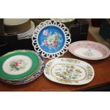 A quantity of plates including green with floral centre, blue and white, Kutani Crane style,