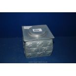 An Arts & Crafts Liberty Style Square Tea Caddy with Floral Relief Decoration in Aluminium by N C