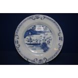 An old Delft blue and white dish with Oriental landscape,