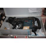 A cased Bosch GSH 10C 1450 watt, 240 volt SDS Hammer Drill/Breaker and 4 various bits.