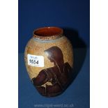 An unusual studio Vase with carved style detail of the back view of a seated figure.