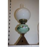 An Oil Lamp with pastel glass bowl
