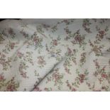 A King size floral quilted Bedcover, with pink roses on white with plain white stitched reverse.