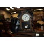 An old wooden Clock in need of refurbishment and a Bust of an Egyptian Pharaoh