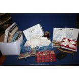 A box of miscellanea including leather purse and wallet, old Teddy bear, embroidery transfers,