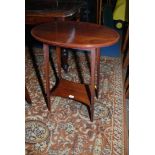 An Edwardian Mahogany oval top Occasional Table with cross-banded edge,