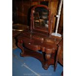 A Victorian Mahogany Duchess Dressing Table with shaped mirror in fluted supports on shaped shelf