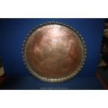 A large Indo/Persian Copper Charger with Tiger design to centre and piecrust edge with traces of