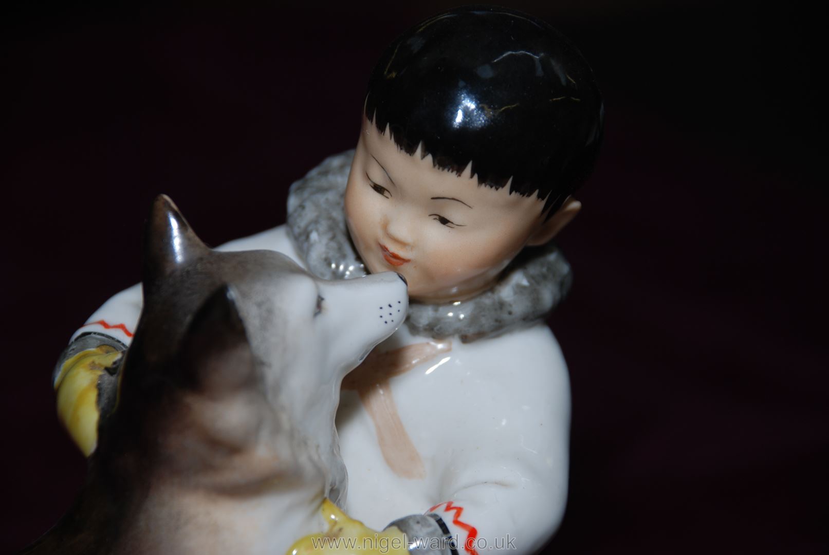 A Russian figure of a young Eskimo boy with his Husky dog. - Image 3 of 11