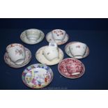 A quantity of tea bowls and saucers in various floral patterns,