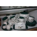 A quantity of 1960's Denby "Greenwheat" pottery including six dinner plates, four side plates,