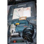 A cased Bosch GST-85 PBE 580 watt 240 volt Professional Jig-saw and assorted blades.