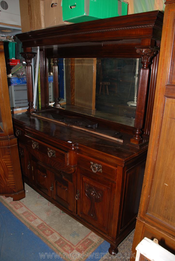 A Victorian stained Walnut mirrorback Sideboard with pediment above reeded column supports and