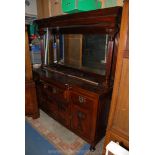 A Victorian stained Walnut mirrorback Sideboard with pediment above reeded column supports and