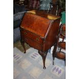 A compact Mahogany and Burr Walnut finished Bureau,