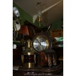A combined Clock/Lamp with the clock set in a ships wheel and surrounded by a port side light and