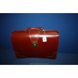 A traditional style top frame English Briefcase in chestnut brown full grain leather by Dents,