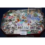 A tin of loose GB Stamps, many commemoratives,