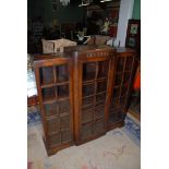 A 1940's glazed Oak three door breakfront Bookcase,